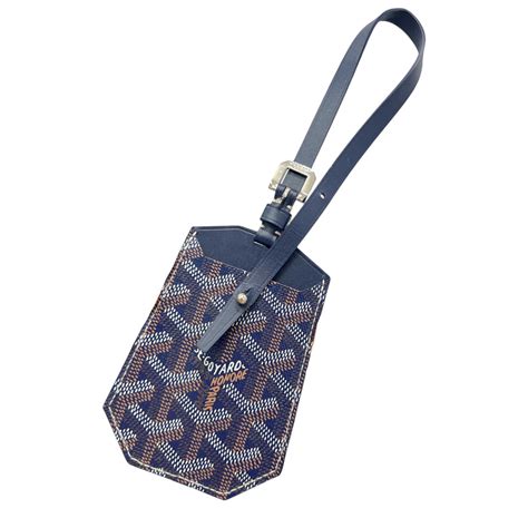 purple goyardine luggage tags.